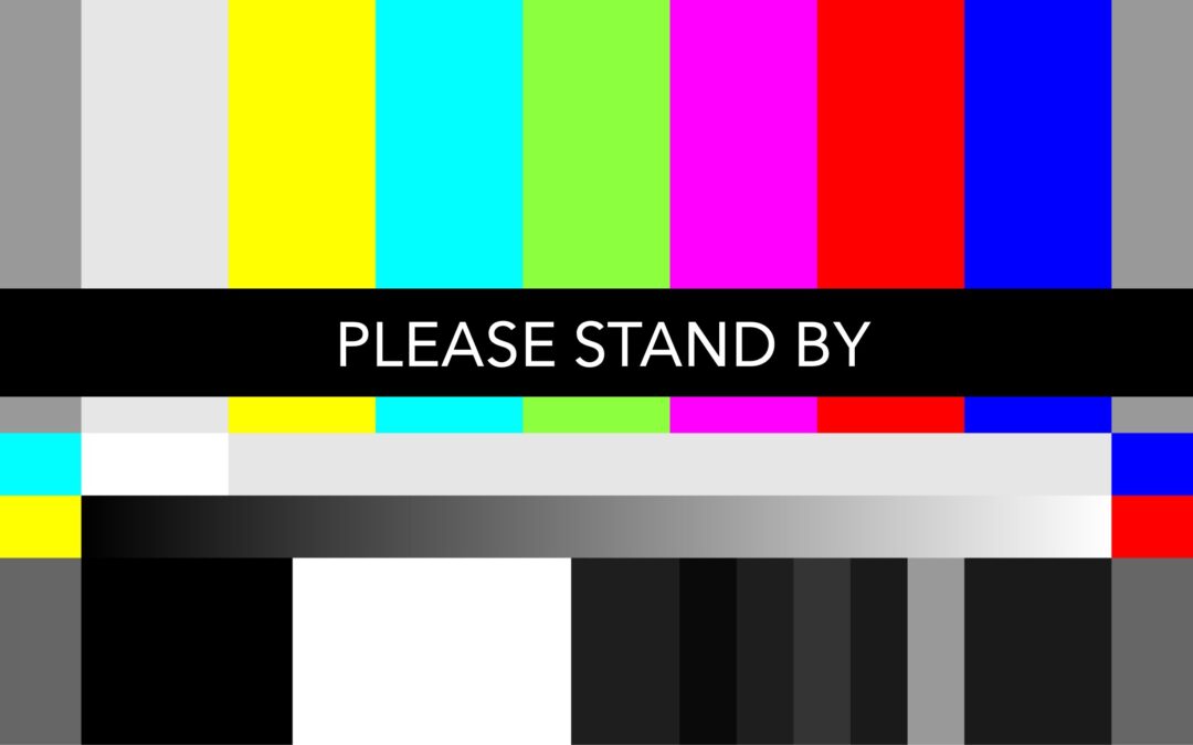 A multi-colored test screen says Please Stand By. Next Stage is disrupting your regularly scheduled programming to bring you the Seven Vital Conditions for Health and Well-being