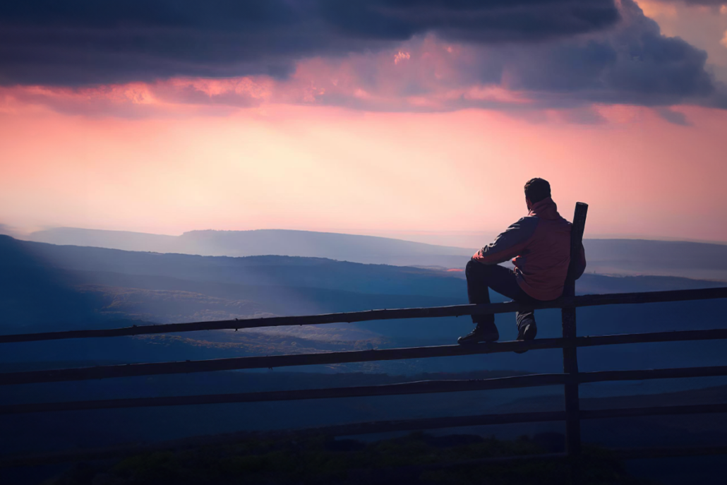 A man sits on a fence, symbolic of the blog's title: Why "Wait and See" is a Failed Strategy