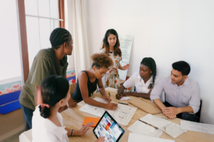 A team of people in an office collaborating on a project.